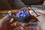 Compact Taurus two-color mechanical puzzle with interlocking purple and red pieces in black base, a challenging brainteaser. - andEleven - The Taurus (2-Color)