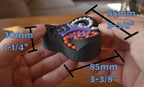 Triangular black mechanical puzzle with colorful gears, handheld brainteaser and fidget toy. - andEleven - The Triad