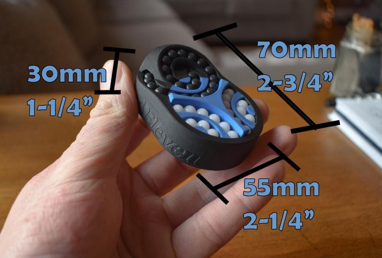 Handheld black and blue mechanical puzzle brainteaser fidget with textured sides and stamped dimensions. - andEleven - The Pretzel