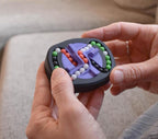 Compact mechanical puzzle with black casing and four colored bead tracks, brainteaser fidget toy held in hands. - andEleven - The Infinity (4-Color)
