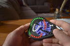 Compact mechanical puzzle with colorful interconnected tracks and beads, a fidget brainteaser toy. - andEleven - The Taurus (4-Color)