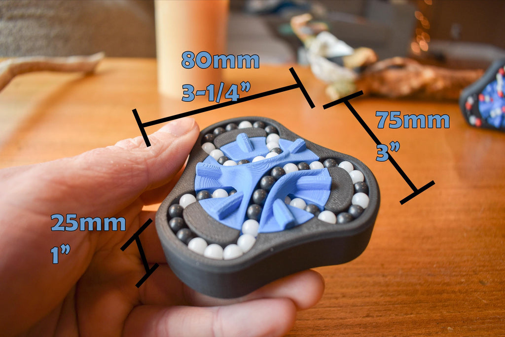 Compact triangular mechanical puzzle fidget with blue and black design and white beads, 3.1 by 3 inches. - andEleven - The Delta (2-Color)